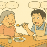 会話しながら、認知症のKさんの食事介助をする場面